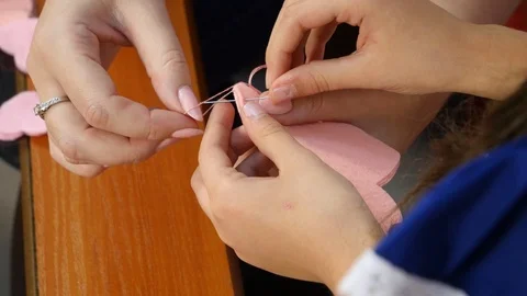 Sewing colored thread to fabric Stock Footage 115522997