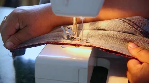 Sewing denim material on the electric machine process Stock Footage 141533031