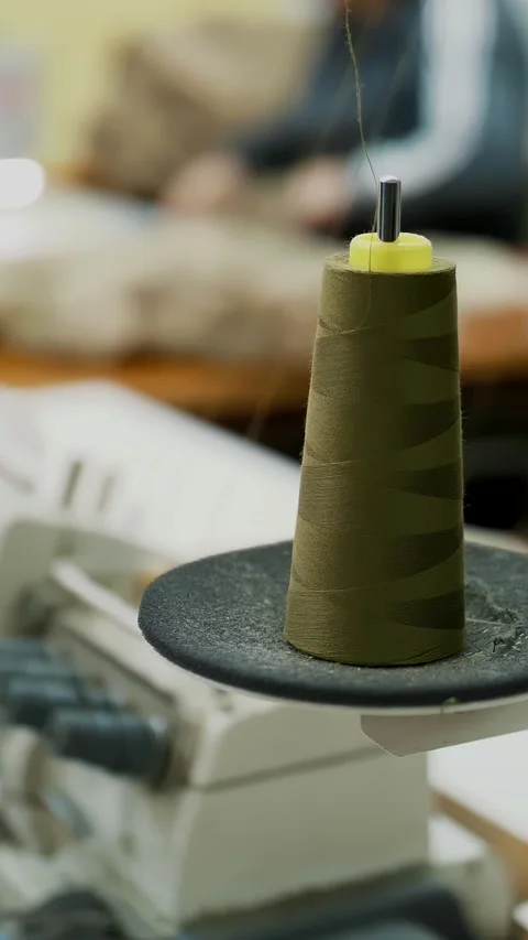 Sewing equipment. sewing spools. Close-up. Spools with thread on working sewing Stock Footage 317940419