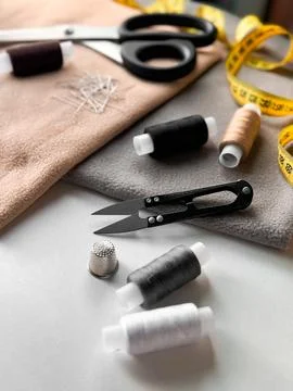 Sewing essentials. Threads, scissors, and fabric for tailoring and diy projects Stock Photos