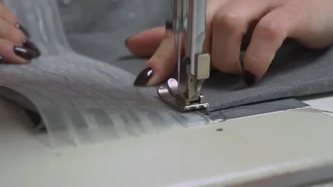 Sewing Fabric with Exceptional Precision Utilizing a HighQuality Sewing Machine Stock Footage 310266487