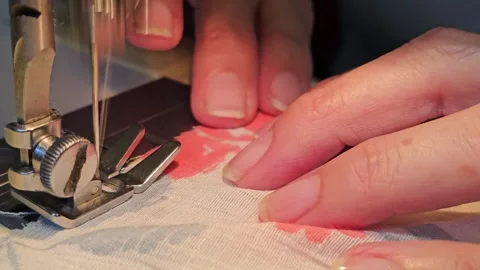 Sewing Fabric with a Machine Stock Footage 305709717