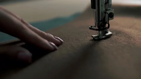 Sewing fabric with threads on a sewing machine close-up. Stock Footage 179703334