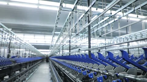 Sewing factory, blue elements, thread holders, hooks, row Stock Footage 208106901