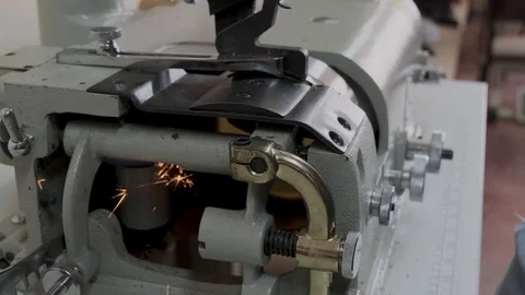 Sewing grinder in a manufacturing sewing workshop or textile sewing factory, Stock Footage 125893526