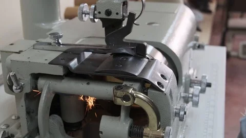 Sewing grinder in a manufacturing sewing workshop or textile sewing factory, Stock Footage 125893553