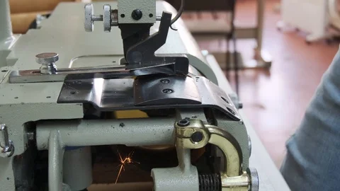 Sewing grinder in a manufacturing sewing workshop or textile sewing factory, Stock Footage 125893577