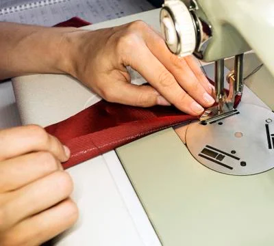 Sewing hands Stock Photos