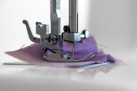 Sewing hobby background. Close up process of sewing on a sewing machine with Stock Photos