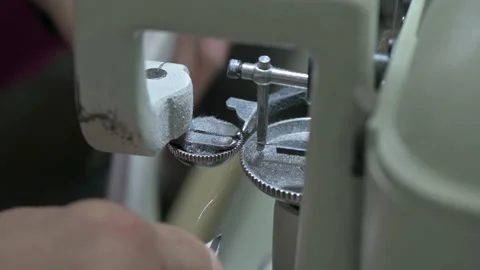 Sewing inner part of sole to soft fabric shoe Stock Footage 147896718