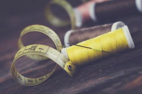 Sewing instruments, threads, needles, bobbins and materials. Stock Photos