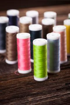 Sewing instruments, threads, needles, bobbins and materials. Stock Photos