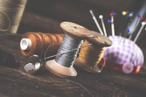 Sewing instruments, threads, needles, bobbins and materials. Stock Photos