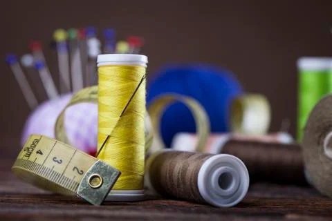 Sewing instruments, threads, needles, bobbins and materials. Stock Photos