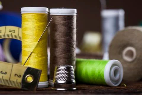 Sewing instruments, threads, needles, bobbins and materials. Stock Photos