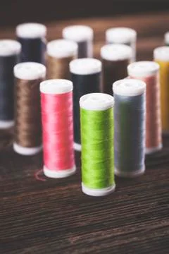 Sewing instruments, threads, needles, bobbins and materials. Stock Photos