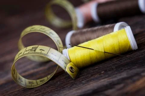 Sewing instruments, threads, needles, bobbins and materials. Stock Photos