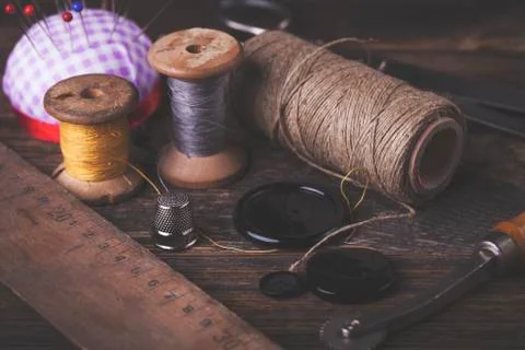 Sewing instruments, threads, needles in vintaae style Stock Photos