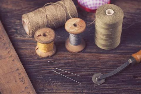 Sewing instruments, threads, needles in vintaae style Stock Photos