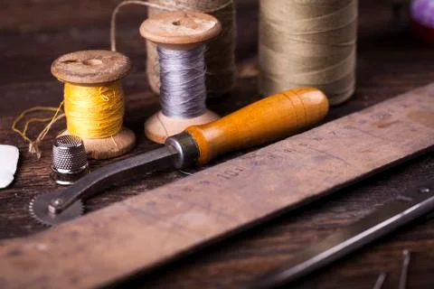 Sewing instruments, threads, needles in vintaae style Stock Photos