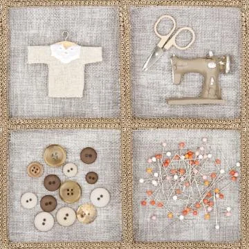 Sewing items on brown background Stock Photos