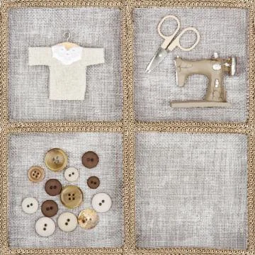 Sewing items on rustic linen background Stock Photos