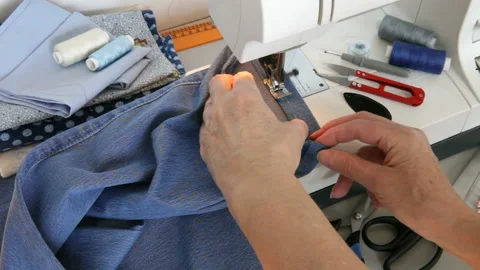Sewing  jeans on a sewing machine at home Stock Footage 201730397