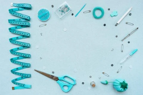 Sewing kit on a blue background. View from above Stock Photos