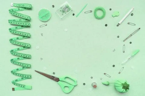 Sewing kit on a mint green background. View from above Foto stock