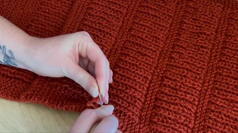 Sewing up a knitting project Stock Footage 170140489