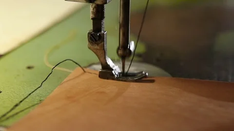 Sewing of leather goods on a sewing machine Stock Footage 80354814