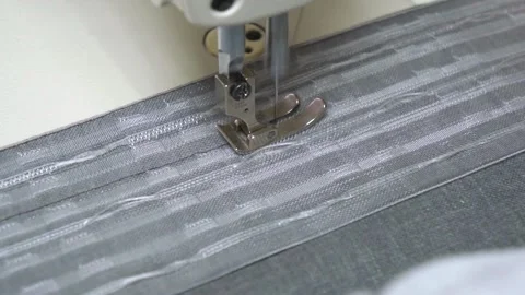 Sewing Machine in Action Creating Stunning and Intricate Fabric Designs with Stock Footage 310266397