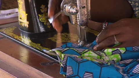 Sewing machine with African fabric Stock Footage