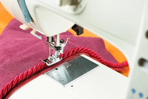Sewing machine and decorative edging cord Stock Photos