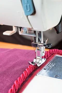Sewing machine and decorative edging cord Stock Photos
