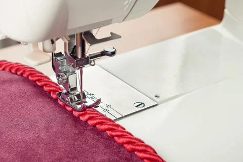 Sewing machine and decorative edging cord Stock Photos