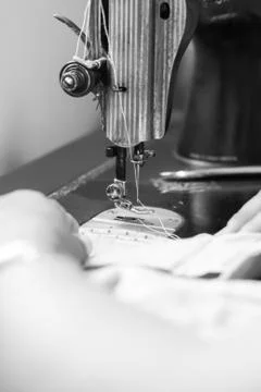 Sewing machine and hand Stock Photos