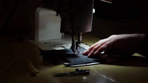 Sewing machine and men's hands of a tailor Stock Footage 183786537