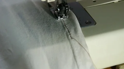 Sewing machine and white shirt Stock Footage