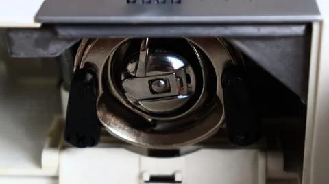 Sewing machine bobbin case cap for the threads Stock Photos