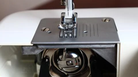 Sewing machine bobbin case cap for the threads Stock Photos