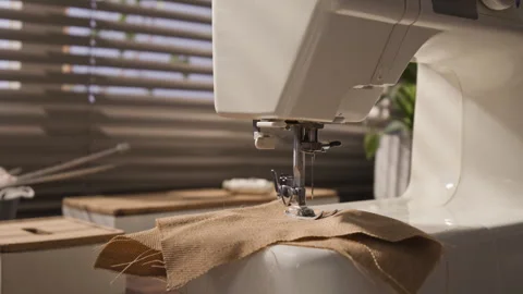 Sewing Machine with Burlap Fabric Prepared for Stitching Stock Footage 341939284