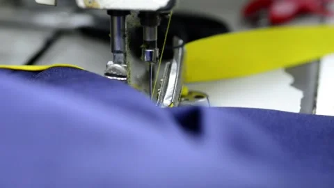 Sewing machine close up macro stitching clothes Video stock 172566267
