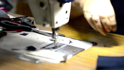 Sewing machine close up macro stitching clothes Video stock 172566284