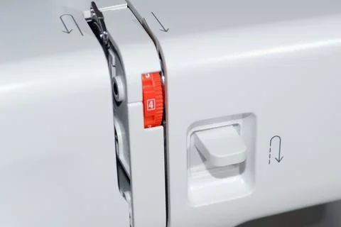 Sewing machine. Close-up reverse stitch button. Foto stock