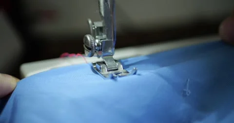 Sewing Machine Close Up Stitching Blue T-shirt Textile Manufacturing Mass Stock Footage 321810179