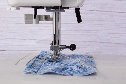 Sewing machine. Closeup the sewing machine and item of clothing. Stock Photos