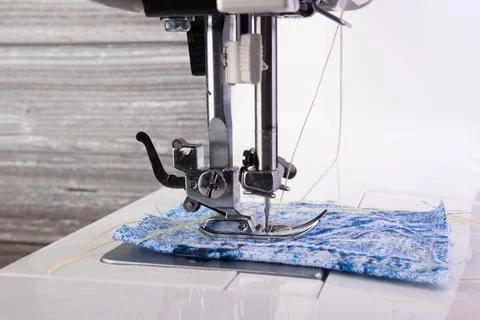 Sewing machine. Closeup the sewing machine and item of clothing. Stock Photos