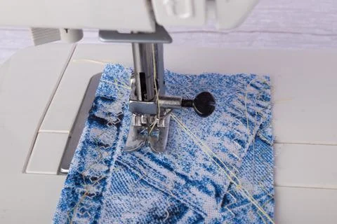 Sewing machine. Closeup the sewing machine and item of clothing. Stock Photos