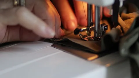Sewing machine on clothes and material. Tailor at work. Close up. Art of sewing Video stock 135135479